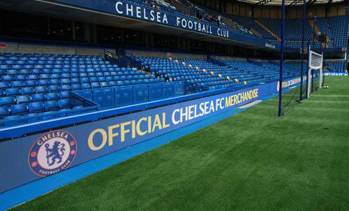 Perimeter LED screens around a football stadium pitch